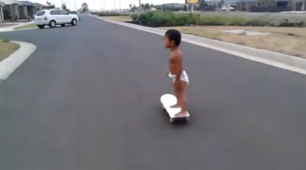 Two-year-old skateboarder shows his skills